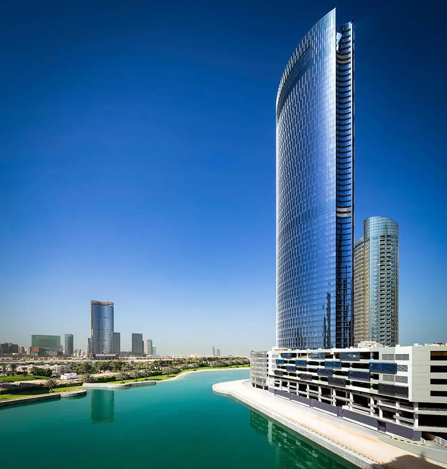Sleek glass high rise exterior architecture of Addax Office Tower in City of Lights Al Reem Island Abu Dhabi.