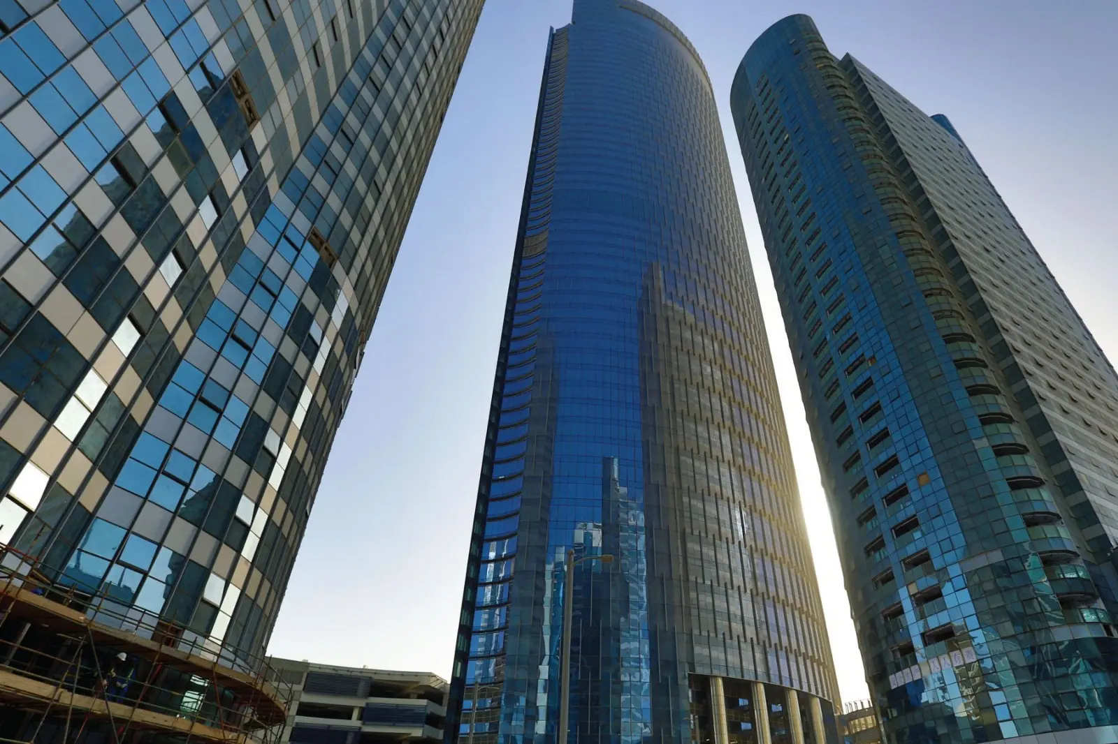 Stunning sunset coastal view of Addax Office Tower in Al Reem Island Abu Dhabi along the Al Maryah canal.
