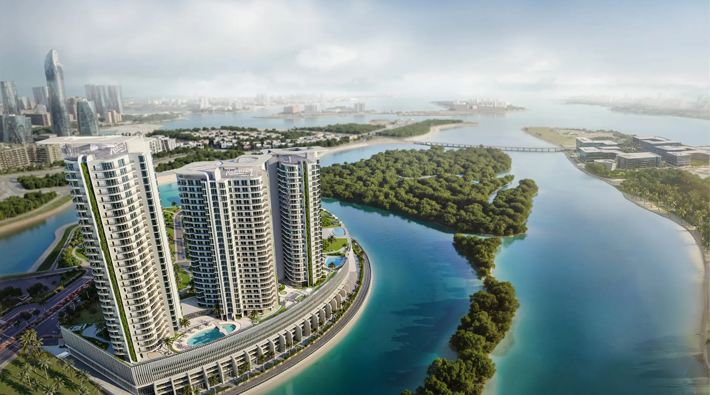 Bird’s-eye view of Radisson Residences Al Reem Island Abu Dhabi towers overlooking mangroves and Abu Dhabi skyline