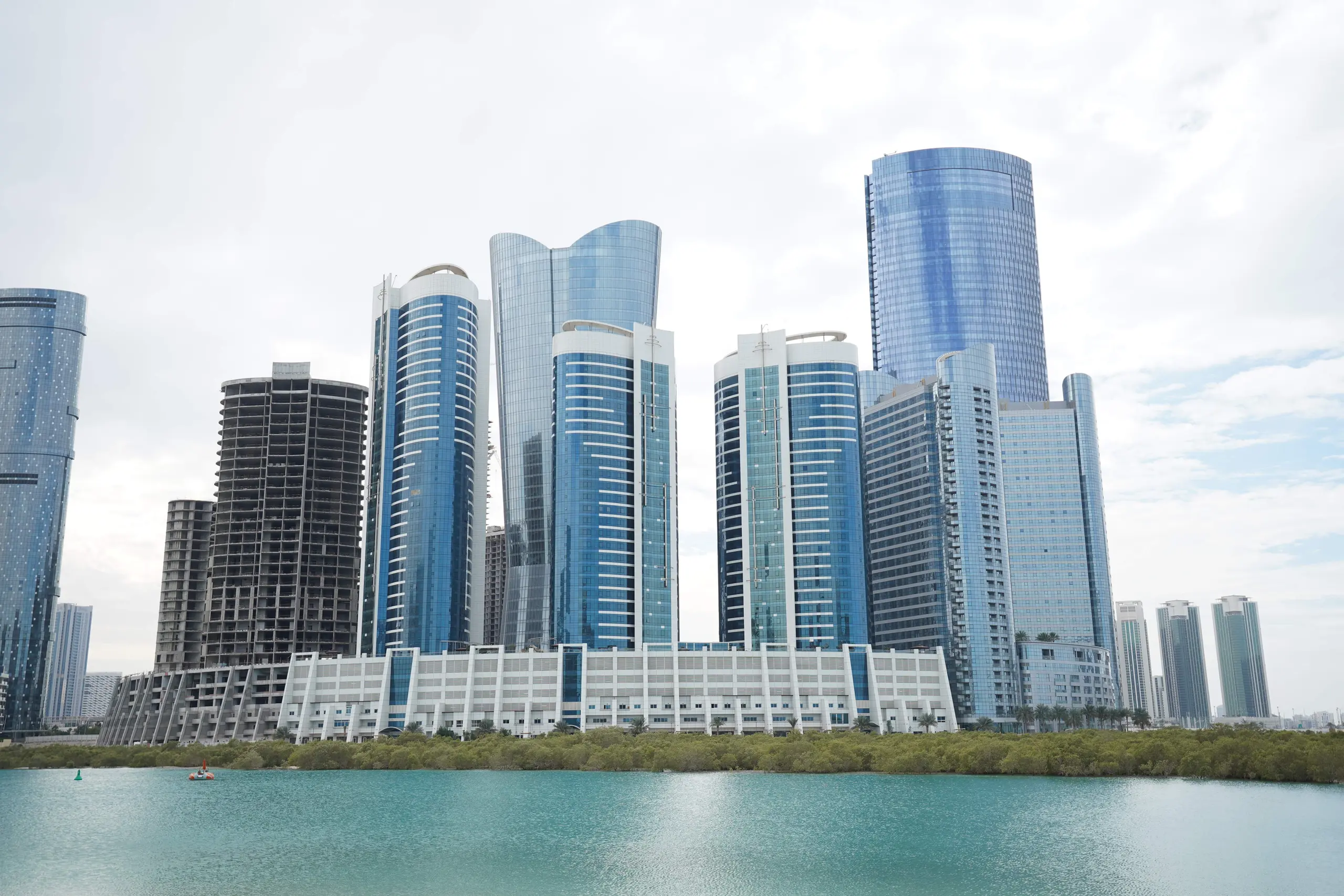 Sigma Tower Al Reem Island Abu Dhabi main entrance exterior view highlighting modern residential tower architecture and landscaping